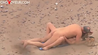 Public Sex With A Busty Teen And A Mature Man On The Beach