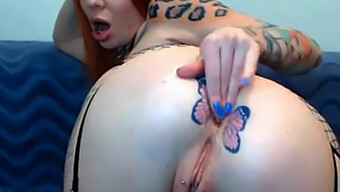 Butterfly Tattooed Beauty Gets Fisted By Webcam